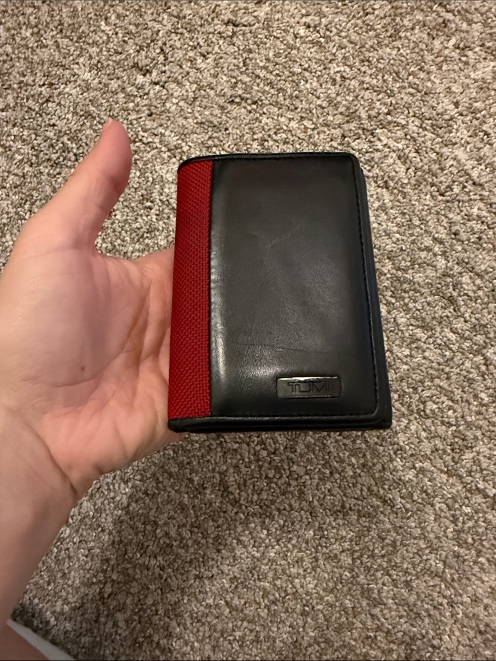 Tumi Black Leather Trifold Wallet with Red Fabric Trim